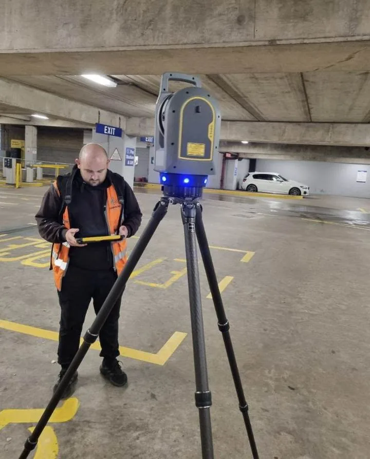 Houseborn engineer operating a Trimble laser scanner
